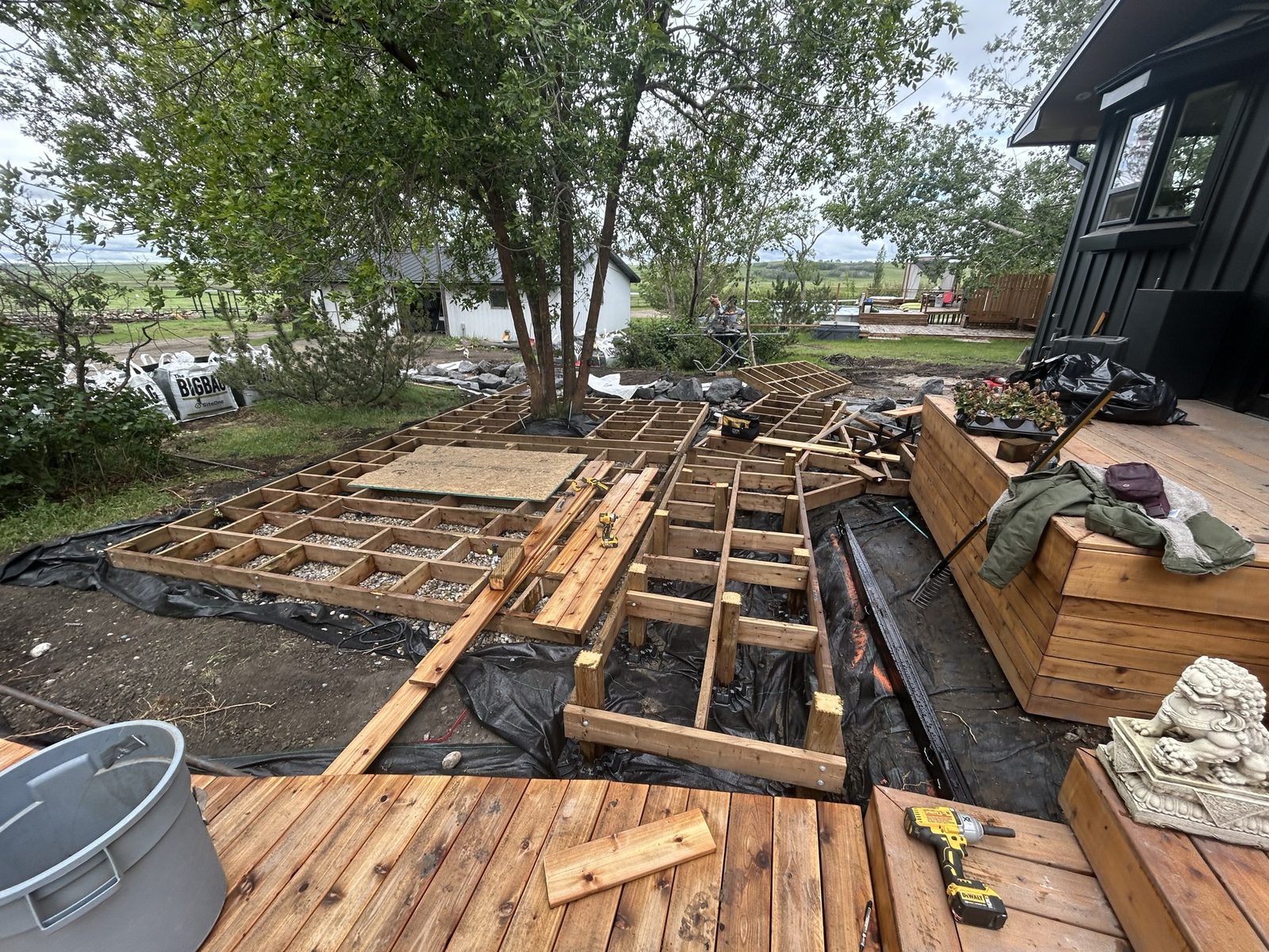 Cedar deck stairs with stone lion detail